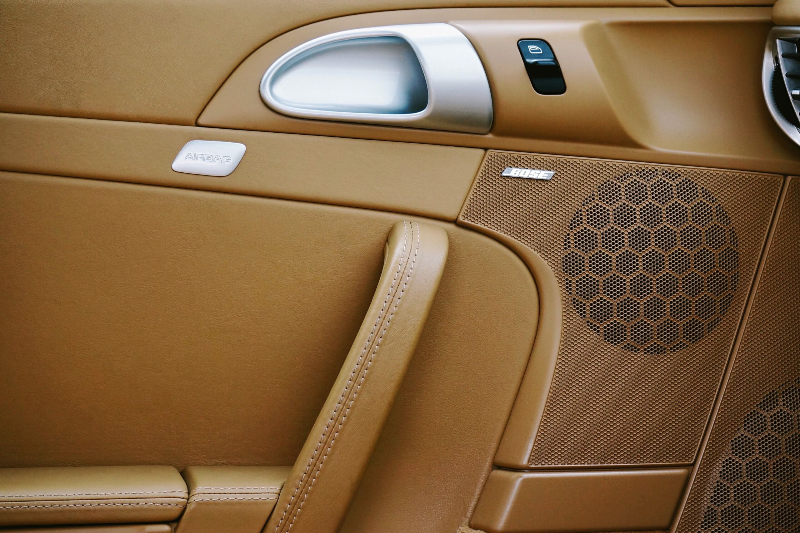 Car door with brown coating.  Illustrative image text moisturizing Bahia leather.